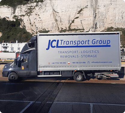 JCL Transport Group van in front of white chalk cliffs